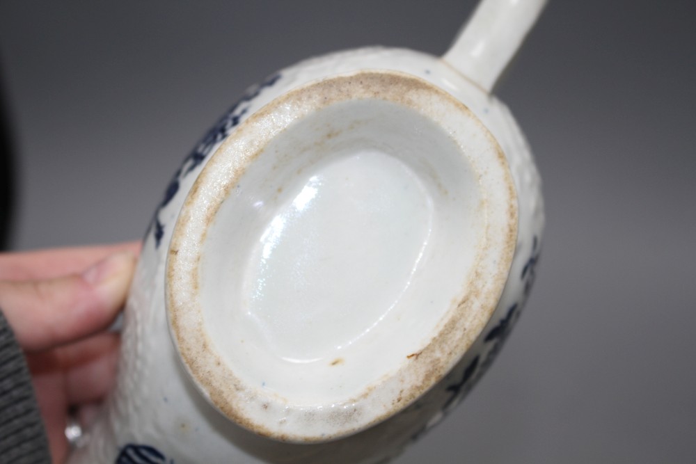 A Lowestoft blue and white sauceboat, c.1770 and two Worcester blue and white sauceboats, c.1758-65